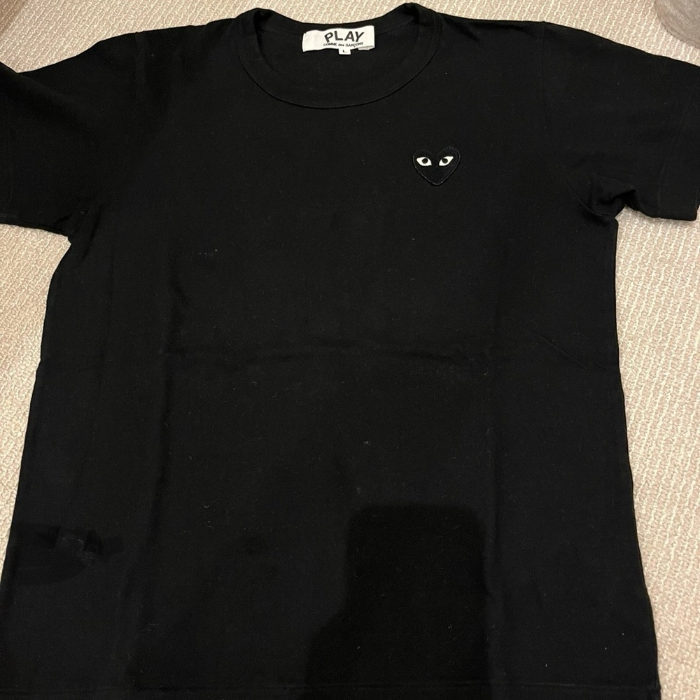 Comme des Garcons PLAY black short sleeve t-shirt with a black heart.
